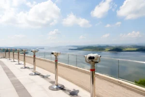 Binoculars line an outdoor deck