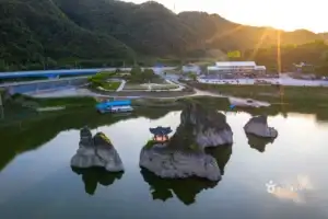 Aerial view of Dodamsambong Peaks and the riverbank at sunset