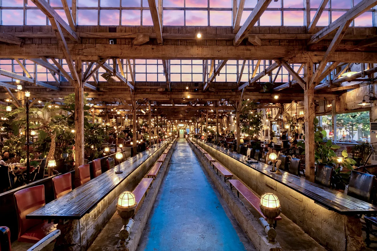 Long wooden tables with warm lighting