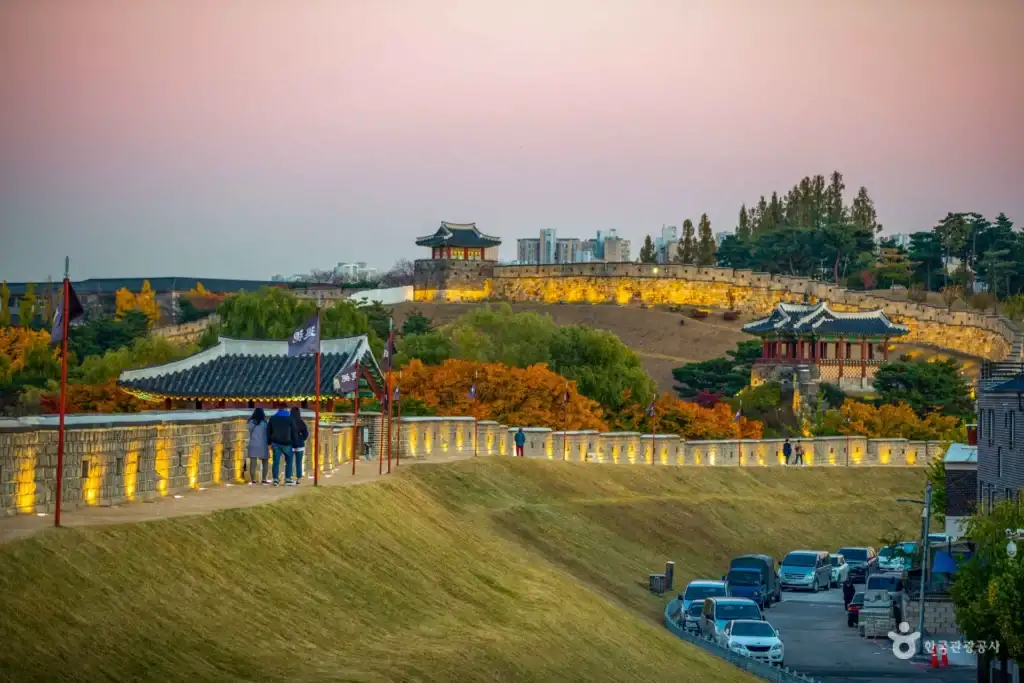 Sunset view of Dongbukporu Pavilion and walls