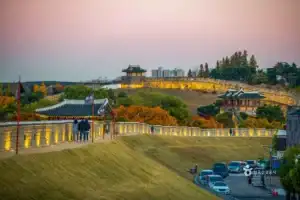 Sunset view of Dongbukporu Pavilion and walls