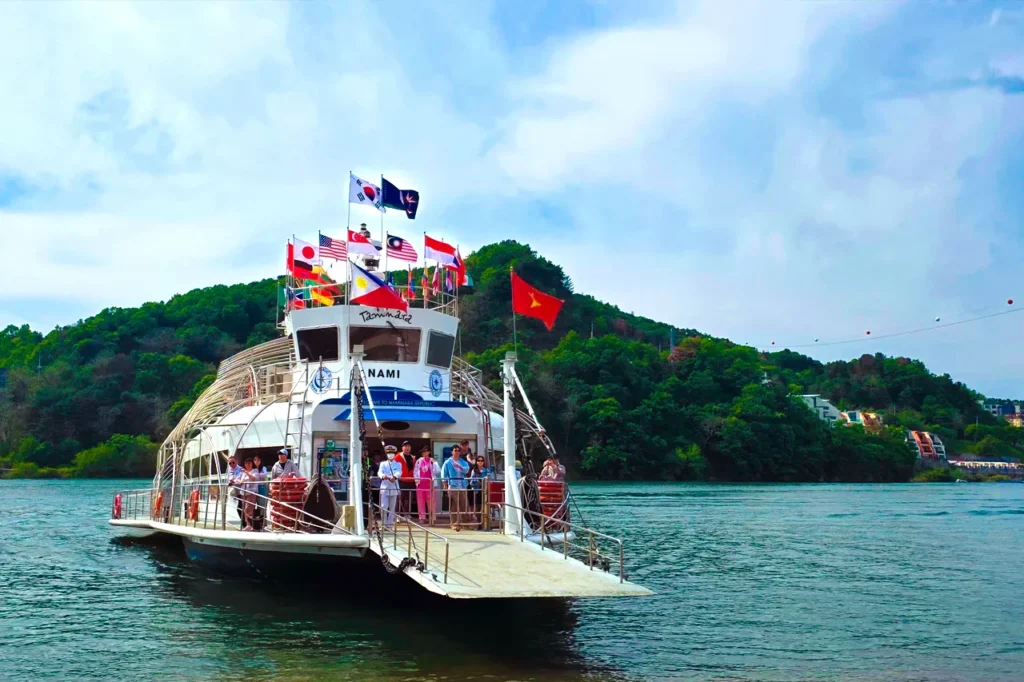 Nami Island ferry with global flags
